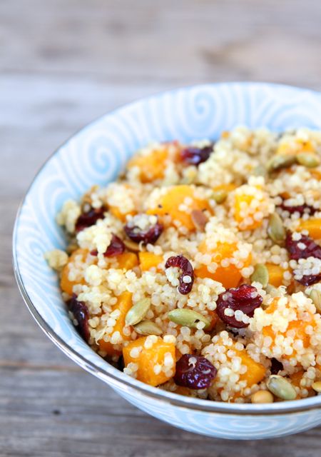 quinoa-salad-with-butternut-squash-dried-cranberries-pepitas a bowl full of simple